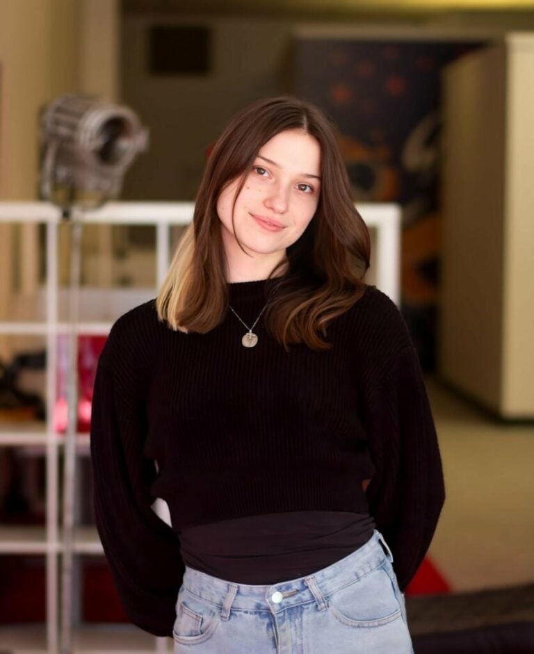 Hannah Nance stands near the entrance to the Datachieve Digital office