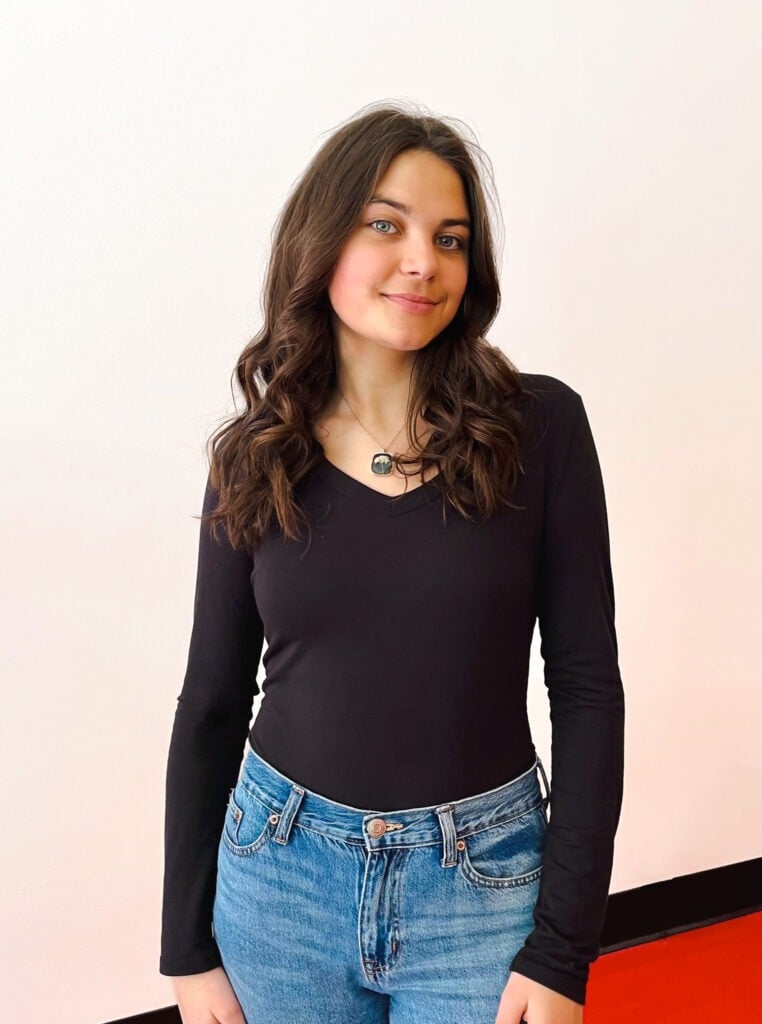 Blake Shupp stands near the entrance to the Datachieve Digital office