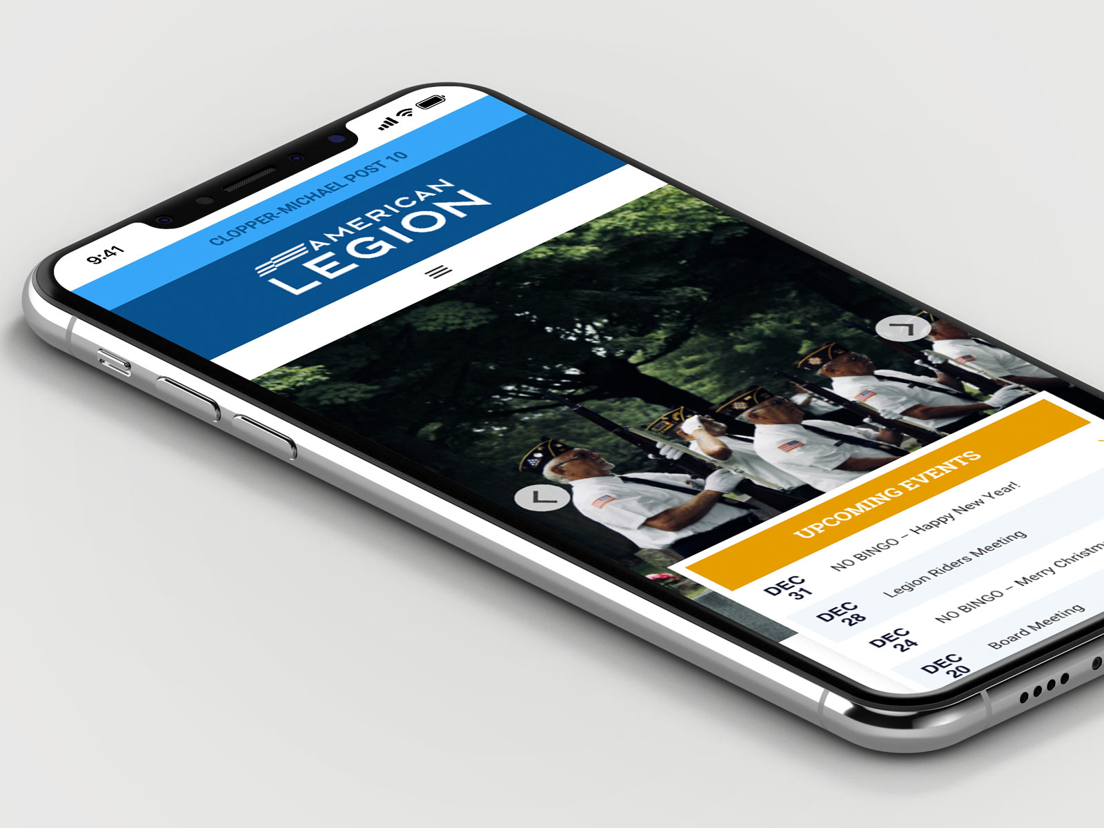 Smartphone displaying the American Legion website with an image of uniformed members and a list of upcoming events in December.